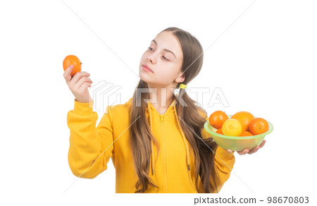 try it. healthy life. diet and kid skin beauty. girl with citrus fruit plate. vitamin and dieting. 98670803