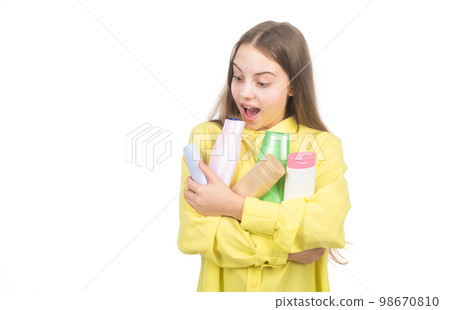 amazed child presenting conditioner bottle isolated on white copy space, hair treatment. 98670810