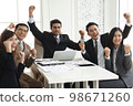 Success group of multiethnic entrepreneurs and business people achieving goals in corporate office, Colleagues cheering and smiling. 98671260