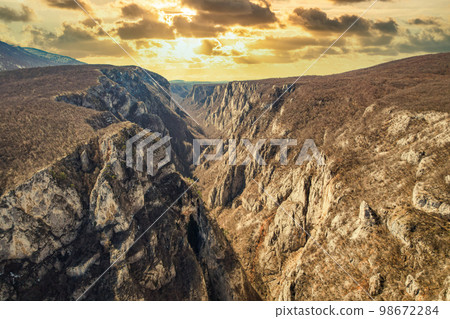 Morning dawn Lazarev Canyon fiery sky with clouds 98672284