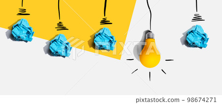 Brainstorming concept with crumpled paper light bulbs 98674271