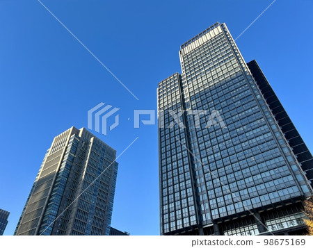 Tokyo: Buildings in the Marunouchi neighborhood (white moon in the sky) / The buildings in Tokyo 98675169