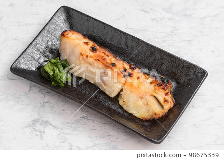 Grilled cod marinated in white miso Grilled cod marinated in white miso 98675339
