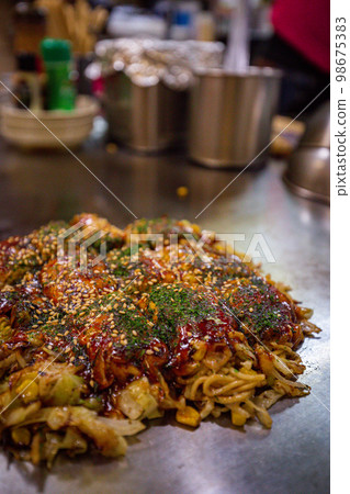 Authentic Hiroshima okonomiyaki at Okonomimura 98675383