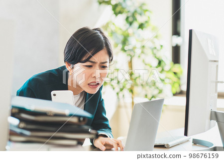 business woman busy with work 98676159