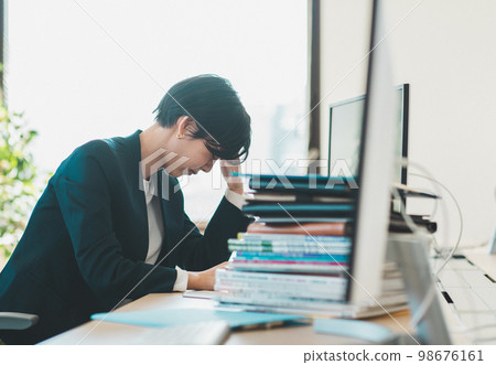 business woman busy with work business woman busy with work 98676161