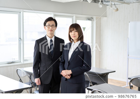 Asian business person standing in seminar room 98676765