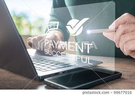 Online payment. Men hands using laptop computer for online shopping. Payment Detail page display. online payment with laptop computer on table Online payment. Men hands using laptop computer for online shopping. Payment Detail page display. online payment with laptop computer on table 98677016