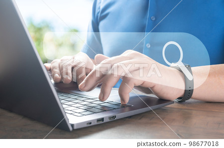 man using laptop, searching web, browsing information. Data Search Technology SEO Search Engine Optimization concept. Data search technology search engine optimization with blank search bar man using laptop, searching web, browsing information. Data Search Technology SEO Search Engine Optimization concept. Data search technology search engine optimization with blank search bar 98677018