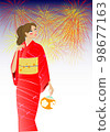 A woman in a kimono and fireworks 98677163