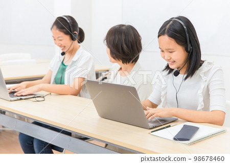 Teacher and child (girl/Japanese) who educates ICT using a personal computer Teacher and child (girl/Japanese) who educates ICT using a personal computer 98678460
