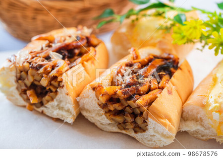 Fried udon bread cut in half 98678576