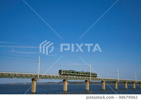 A train running through Lake Kasumigaura A train running through Lake Kasumigaura 98679982