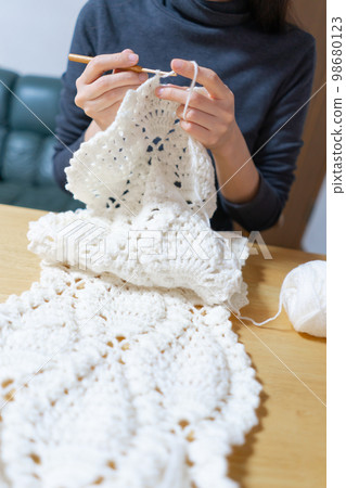 Knitting woman, crochet 98680123