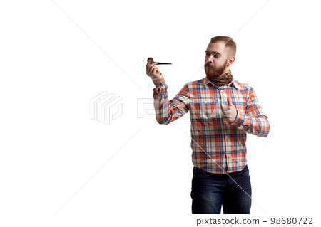 Handsome beard redhead man in checked shirt with thumb up shows smoking pipe on white background 98680722