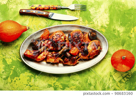 Baked chicken legs 98683160