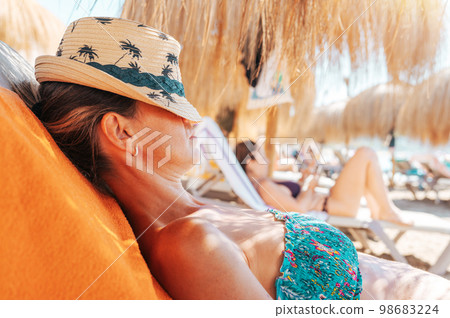 Woman relaxes on vacation in kenya at the beach Woman relaxes on vacation in kenya at the beach 98683224