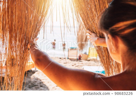 Woman relaxes on vacation in kenya at the beach Woman relaxes on vacation in kenya at the beach 98683226