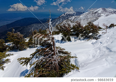 View of the remaining snow in the Northern Alps, Mt. Chogatake and Azumino 98683659