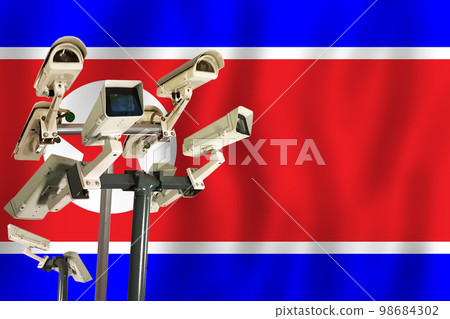 North Korean CCTV camera on the flag of DPRK Surveillance, security, control and totalitarianism  98684302