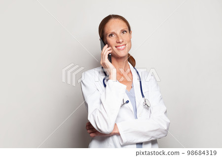 Modern female portrait of happy successful attractive mature adult woman doctor Modern female portrait of happy successful attractive mature adult woman doctor 98684319