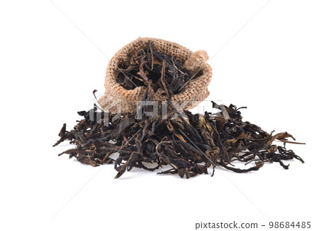 Dry black tea leaves isolated on a white background Dry black tea leaves isolated on a white background 98684485