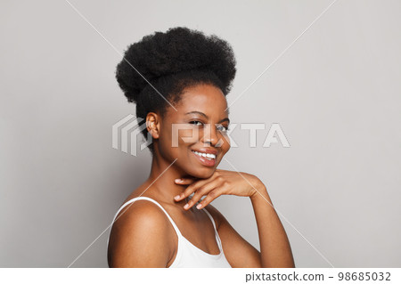 Cheerful model woman with dark clean fresh smooth skin portrait. Cute female face Cheerful model woman with dark clean fresh smooth skin portrait. Cute female face 98685032