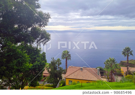 Beautiful view of the tropical green island and the ocean. Beautiful view of the tropical green island and the ocean. 98685496