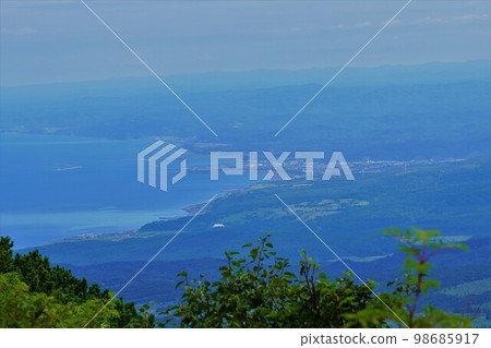 Rumoi cityscape and coastline from Mt. Shokanbetsu 98685917