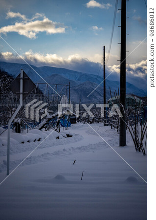 Snowy road Snowy road 98686012