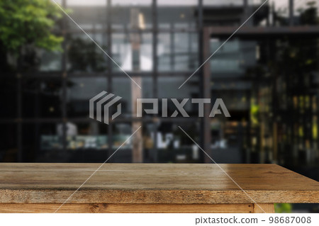 Empty dark wooden table in front of abstract blurred bokeh background of restaurant . can be used for display or montage your products.Mock up for space. Empty dark wooden table in front of abstract blurred bokeh background of restaurant . can be used for display or montage your products.Mock up for space. 98687008