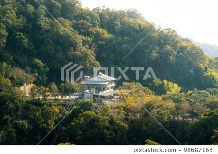 Single-family house in the forest on the mountain Single-family house in the forest on the mountain 98687163