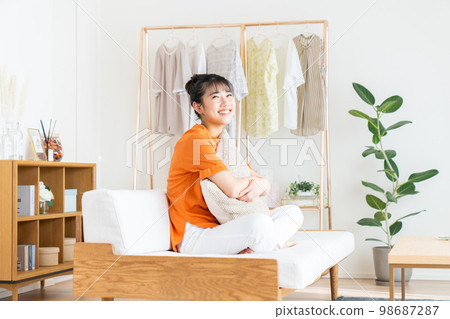 Young woman relaxing in the living room 98687287