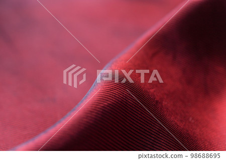 Closeup of red satin fabric Closeup of red satin fabric 98688695