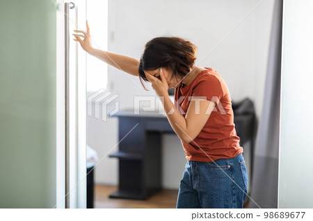 Vertigo Concept. Middle Eastern Woman Feeling Unwell At Home, Suffering Head Spinning Vertigo Concept. Middle Eastern Woman Feeling Unwell At Home, Suffering Head Spinning 98689677