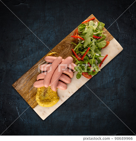 Wiener served with mustard 98689966