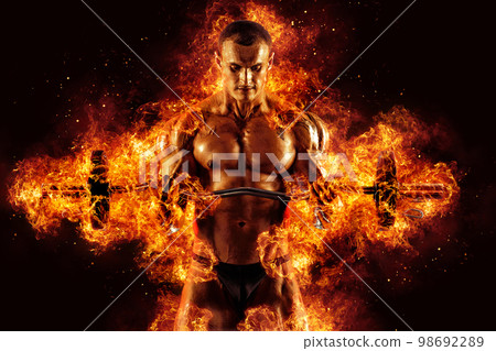 The shirtless abdominal male holds dumbbell. Studio shot in contrasty light The shirtless abdominal male holds dumbbell. Studio shot in contrasty light 98692289