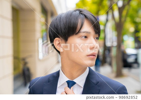 Portrait of a cool office worker outdoors salesman beauty job job hunting job change confidence walking around town fashionable 98692852