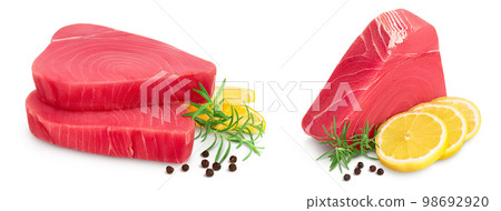 Fresh tuna fish fillet steak with rosemary, lemon and peppercorns isolated on white background with full depth of field 98692920