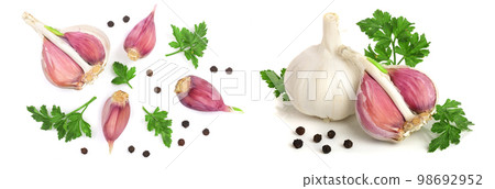 garlic with peppercorns and parsley leaves isolated on white background. Top view. Flat lay pattern garlic with peppercorns and parsley leaves isolated on white background. Top view. Flat lay pattern 98692952