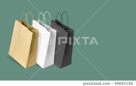 Paper bags for shopping on green background. Copy space Paper bags for shopping on green background. Copy space 98693189
