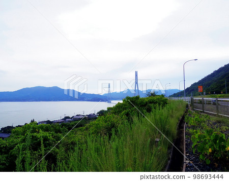 Omishima Island and Tatara Bridge seen from Ikuchijima Island Omishima Island and Tatara Bridge seen from Ikuchijima Island 98693444