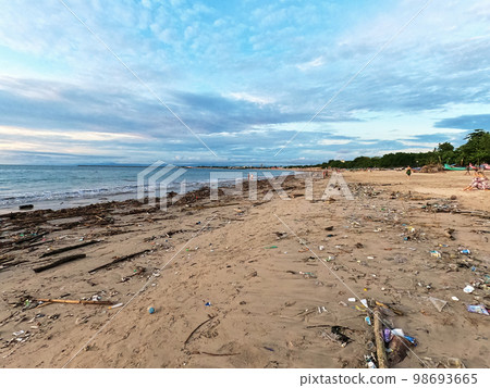 Garbage washed up on the beach from the ocean after high tide. An environmental disaster Garbage washed up on the beach from the ocean after high tide. An environmental disaster 98693665