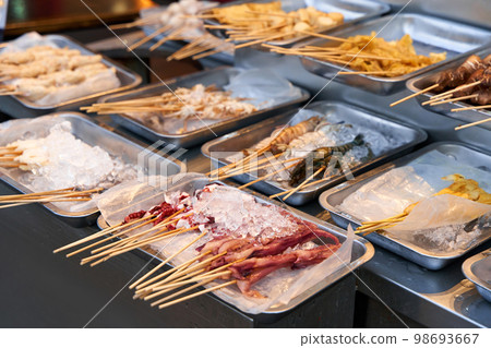BBQ seafood preparations on the cafe counter in plates with ice 98693667