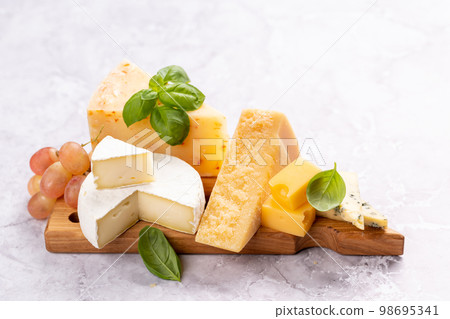 Various cheese on board 98695341