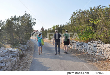 People enjoying a walk on Šolta, a popular vacation destination from Split, Croatia 98696600