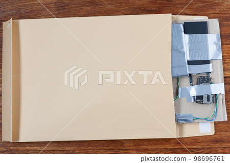 Mail bomb IED - Improvised Explosive Device with c4 and cell phone module in envelope 98696761