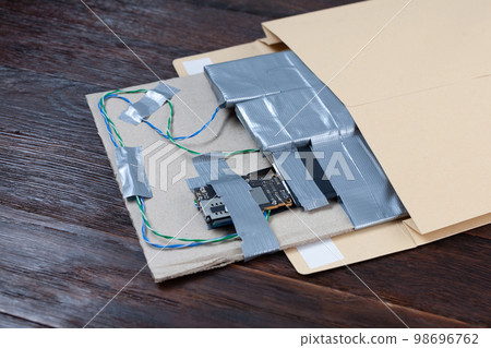 Mail bomb IED - Improvised Explosive Device with c4 and cell phone module in envelope Mail bomb IED - Improvised Explosive Device with c4 and cell phone module in envelope 98696762