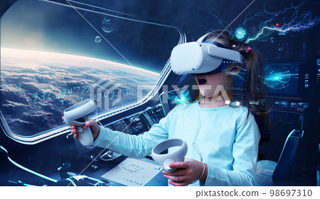 Metaverse and kid concept, child using virtual reality headset in space adventure game 98697310
