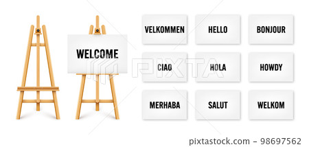 Realistic paint desk with text on white canvas. Wooden easel and a sheet of drawing paper. Presentation board on a tripod. You are welcome, greetings and respects. Vector illustration Realistic paint desk with text on white canvas. Wooden easel and a sheet of drawing paper. Presentation board on a tripod. You are welcome, greetings and respects. Vector illustration 98697562